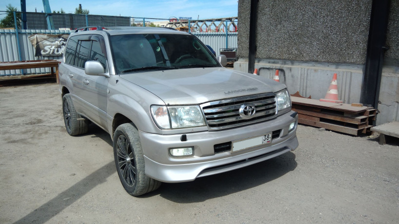 Накладка на передний бампер (сток) Toyota Land Cruiser 100 купить недорого с доставкой в Тобольск